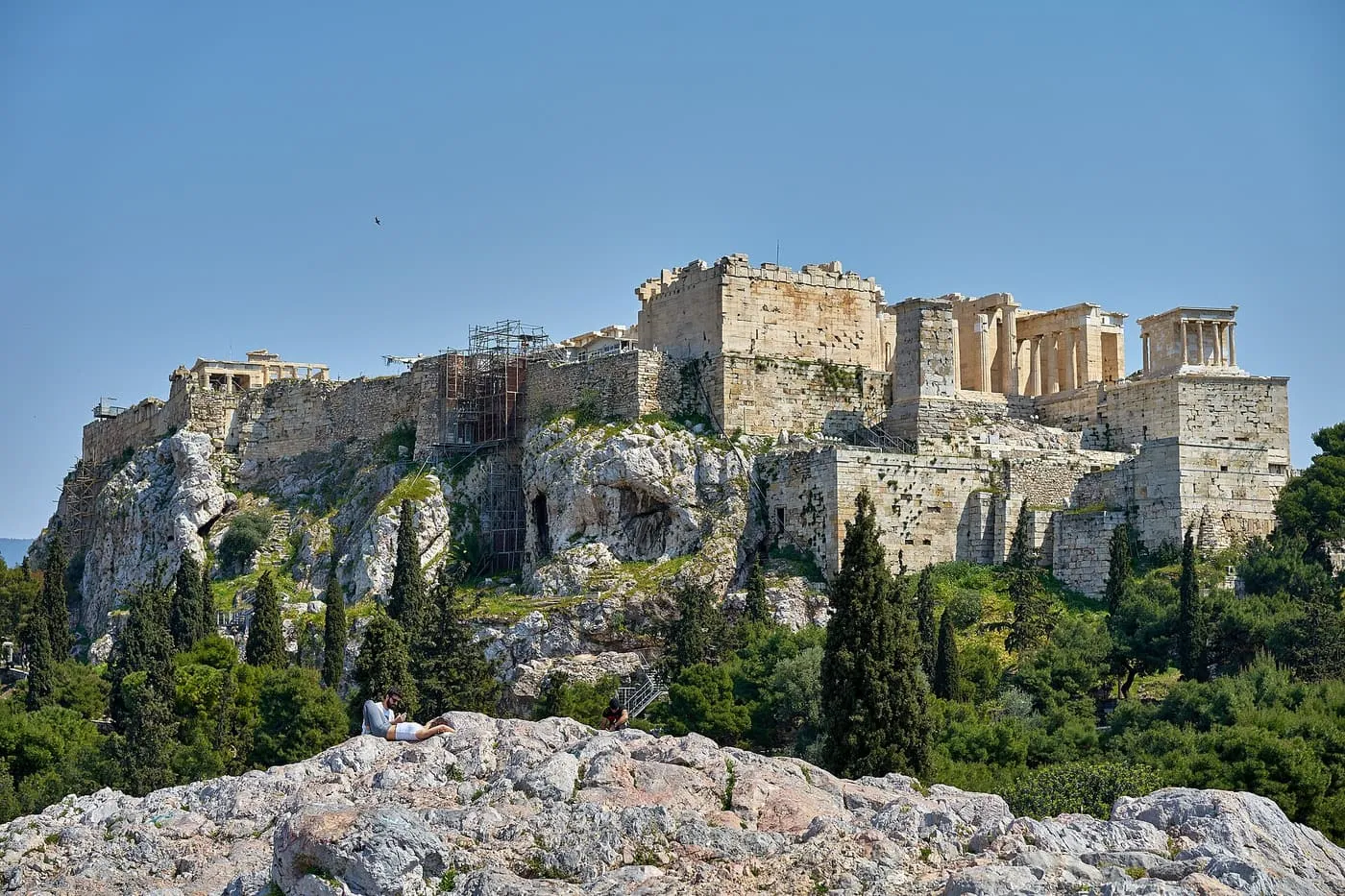The Propylaia and the Temple of Athena Nike on the Acropolis rock, seen from the pale limestone summit of the Areopagus
