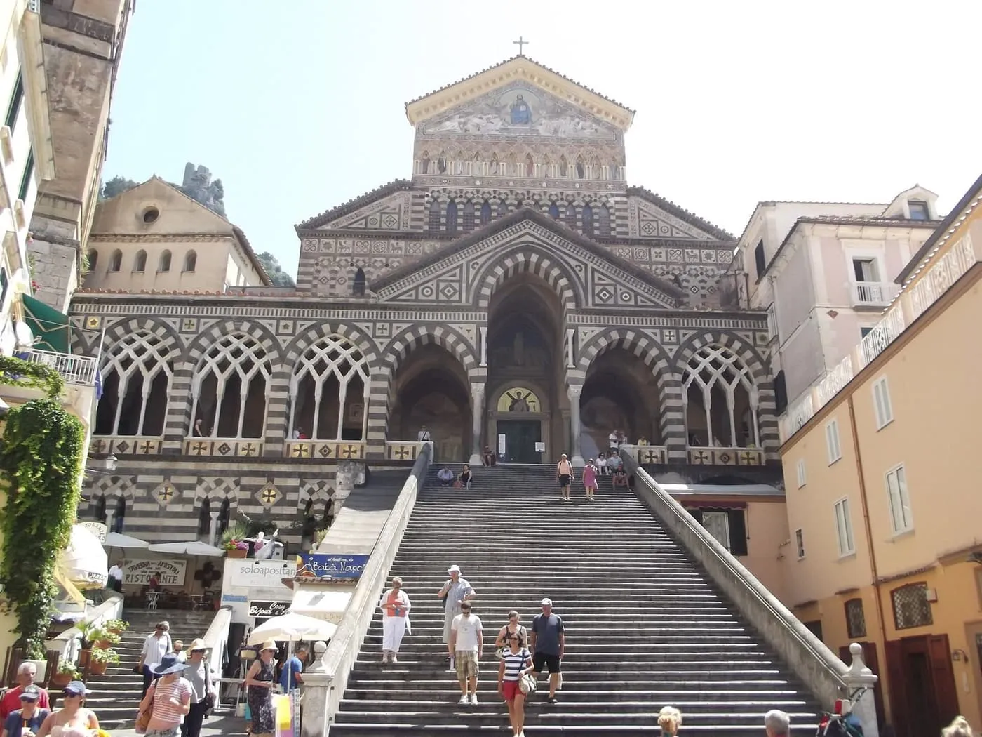 The striped black-and-white facade of Amalfi Cathedral above its wide flight of steps