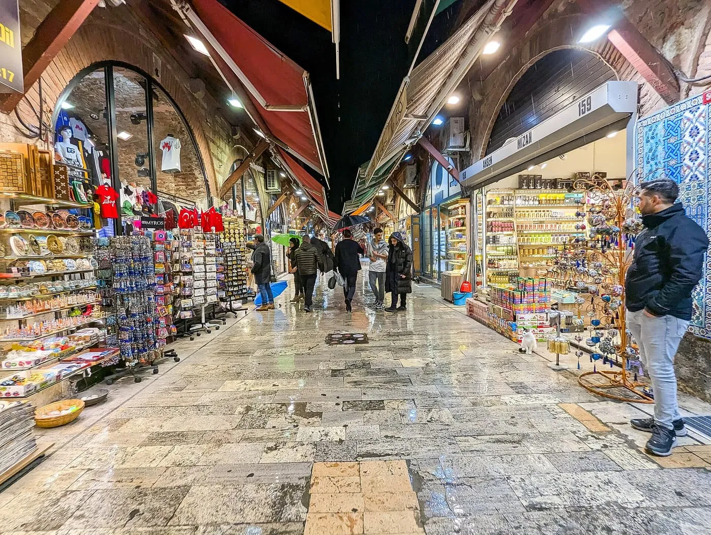 The Arasta Bazaar: a stone-paved lane with carpet and souvenir shops under awnings and a few shoppers