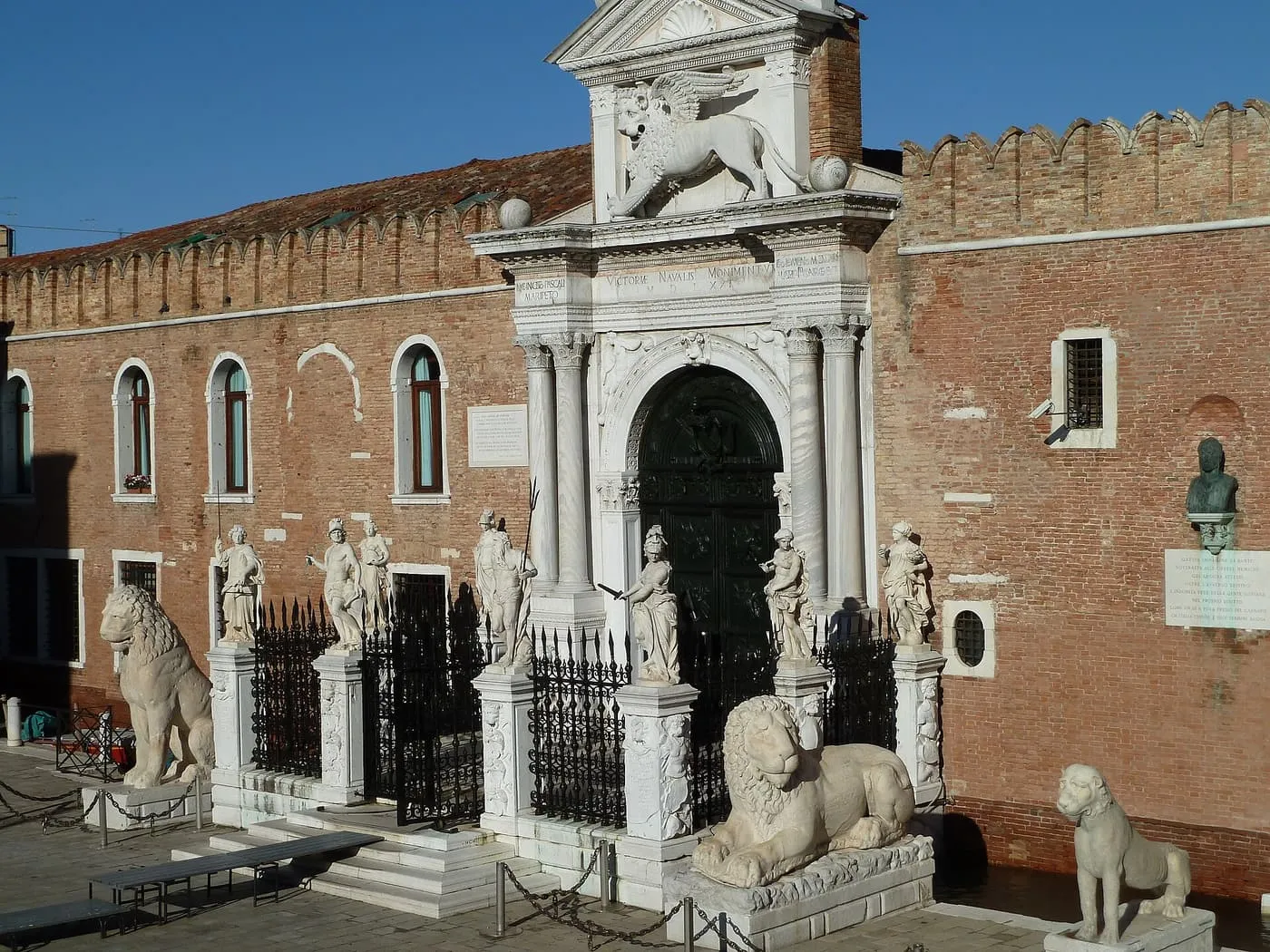 The Porta Magna, the Arsenale's white stone gateway with the winged lion, flanked by stone lions