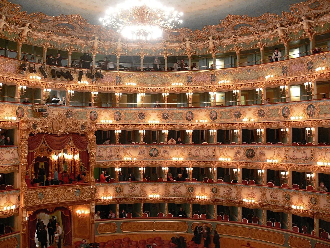 The auditorium of La Fenice, with tiers of gilded boxes under a chandelier