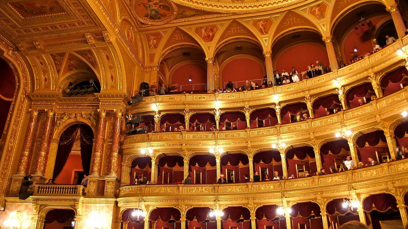 The gilded horseshoe auditorium of the Hungarian State Opera House, with red-curtained boxes on several tiers