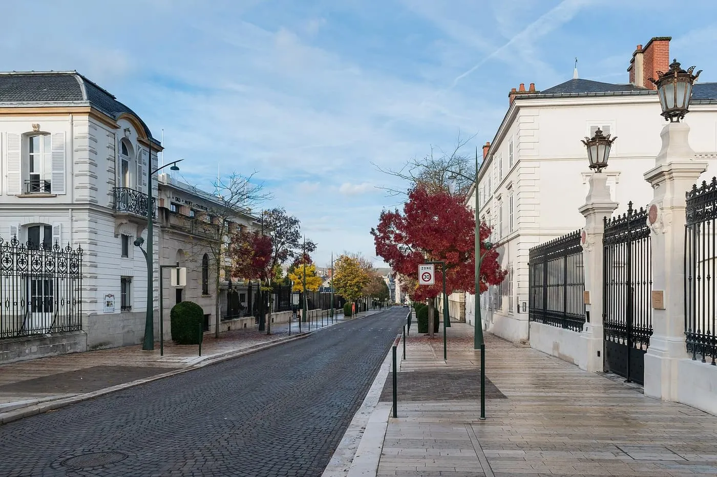 The Avenue de Champagne in Épernay, a cobbled street of white mansions and iron gates lined with autumn trees