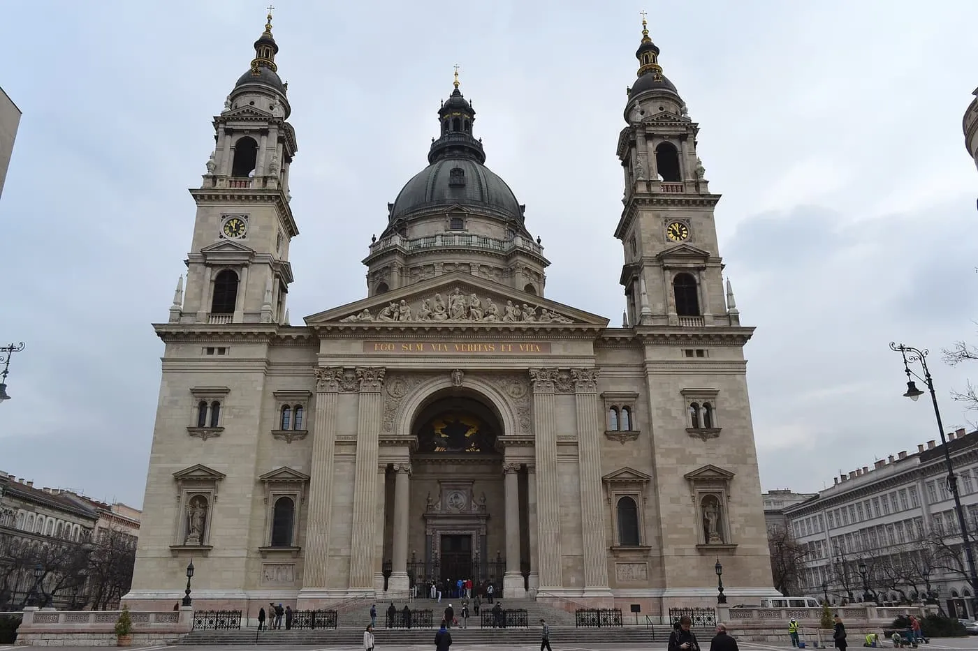 The twin-towered front of St Stephen's Basilica with its dome behind, seen across the square