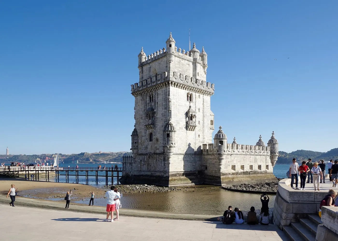 Belém Tower on the Tagus, with visitors on the promenade in the foreground
