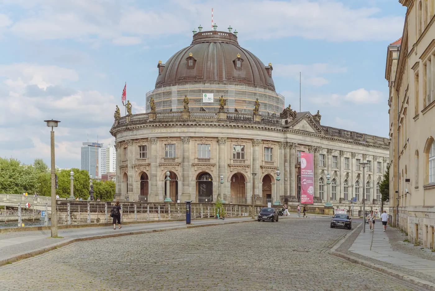 The Bode-Museum and its copper dome at the tip of Museum Island, seen along the cobbles of Am Kupfergraben