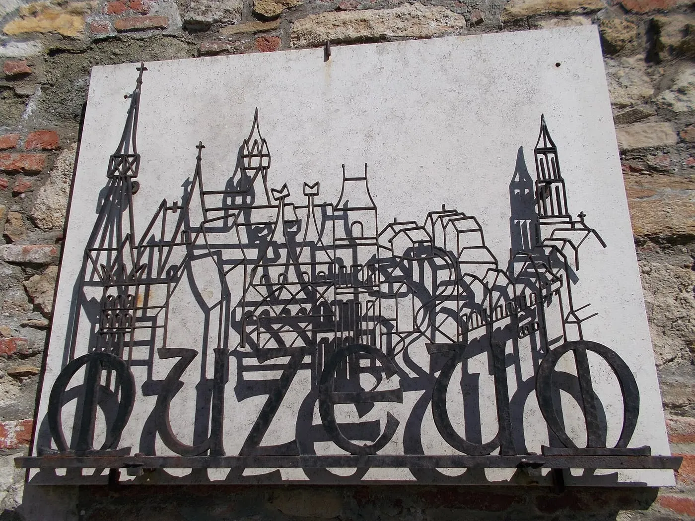 A wrought-iron "Múzeum" sign in the courtyard of the Budapest History Museum