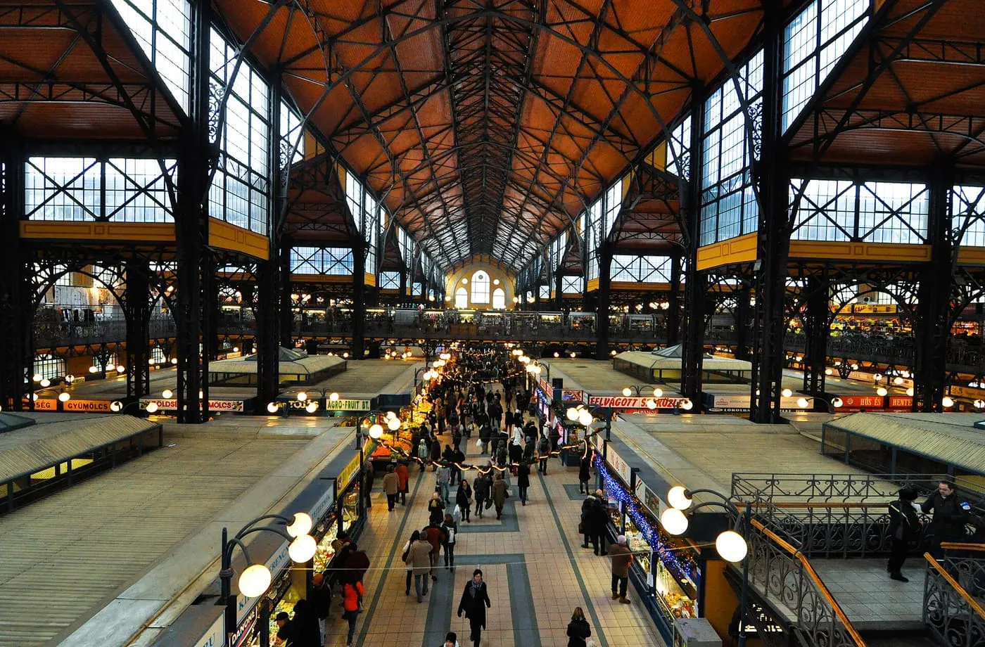 The iron-framed hall of the Central Market Hall, with stalls along the main aisle under a pitched roof