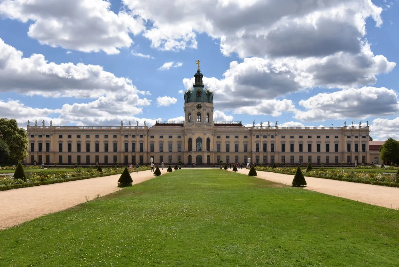 The garden front of Charlottenburg Palace with its domed central tower, seen across a lawn and gravel paths
