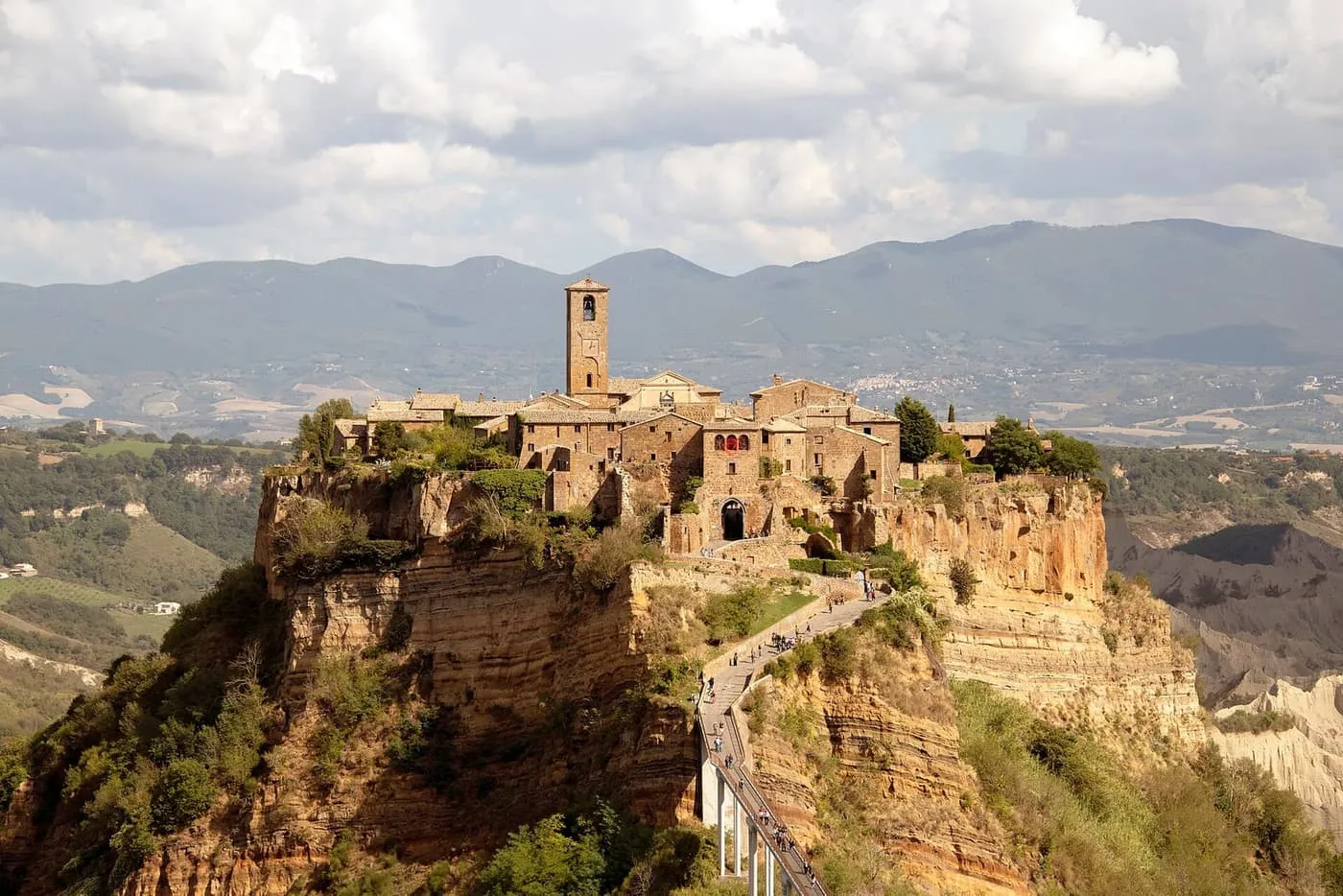 Civita di Bagnoregio on its rock, with the footbridge climbing to the village from the bottom right