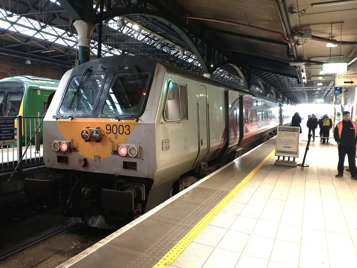 A train for Belfast standing at a platform under the roof of Dublin Connolly station