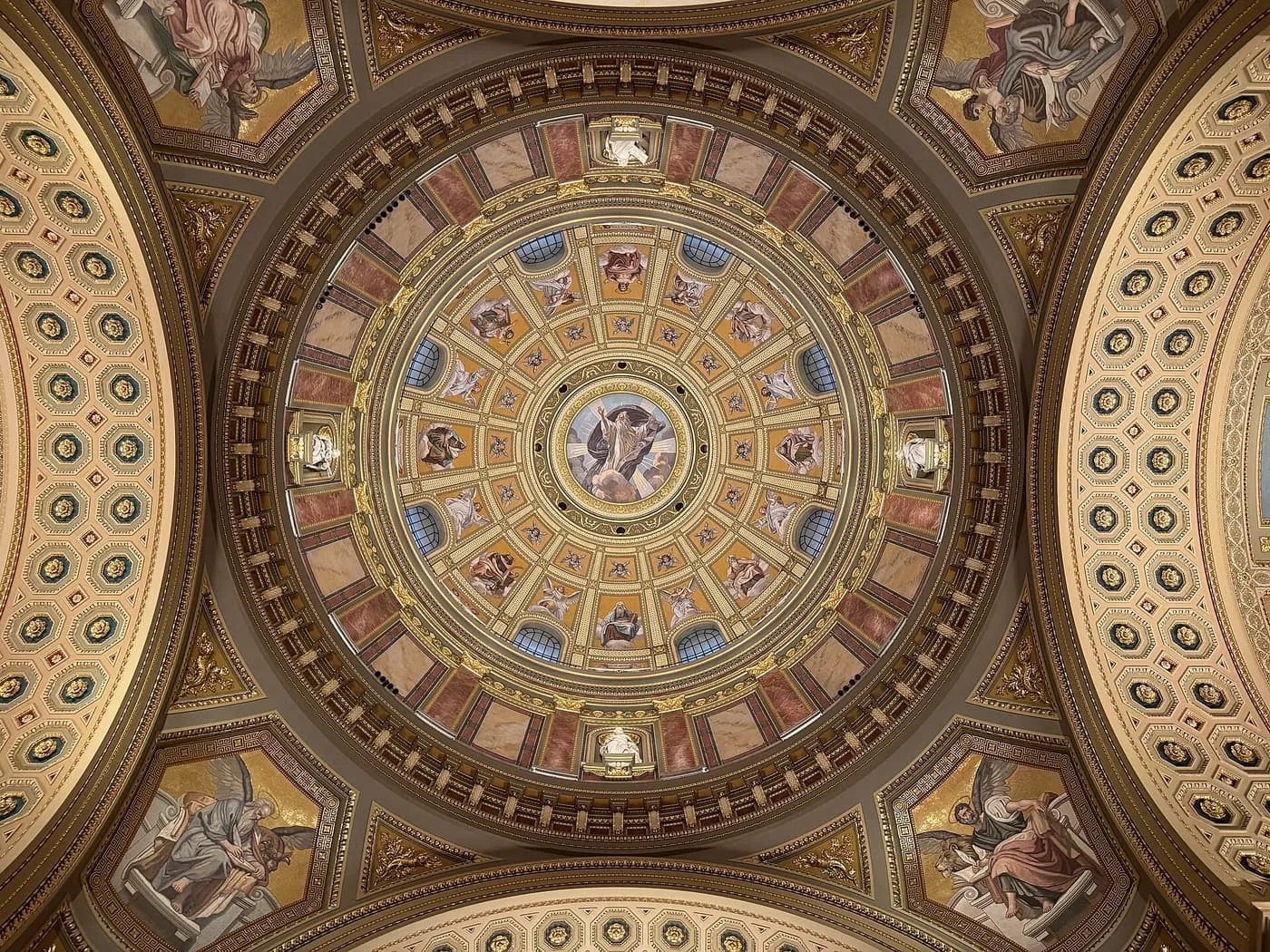 Looking up into the dome of St Stephen's Basilica, with its painted coffered ceiling, gilded ribs and mosaic figures