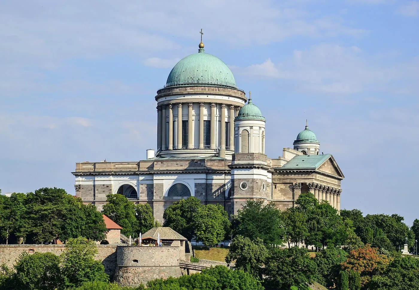 The green copper dome and towers of Esztergom Basilica above the town walls