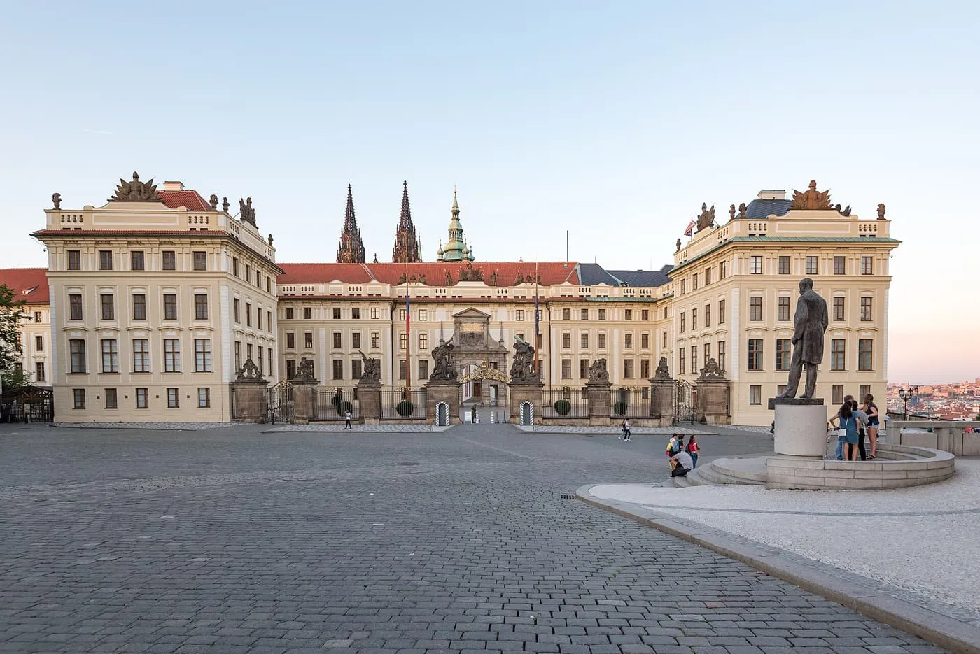 The gate to Prague Castle's First Courtyard from Hradčany Square, with the spires of St Vitus Cathedral behind