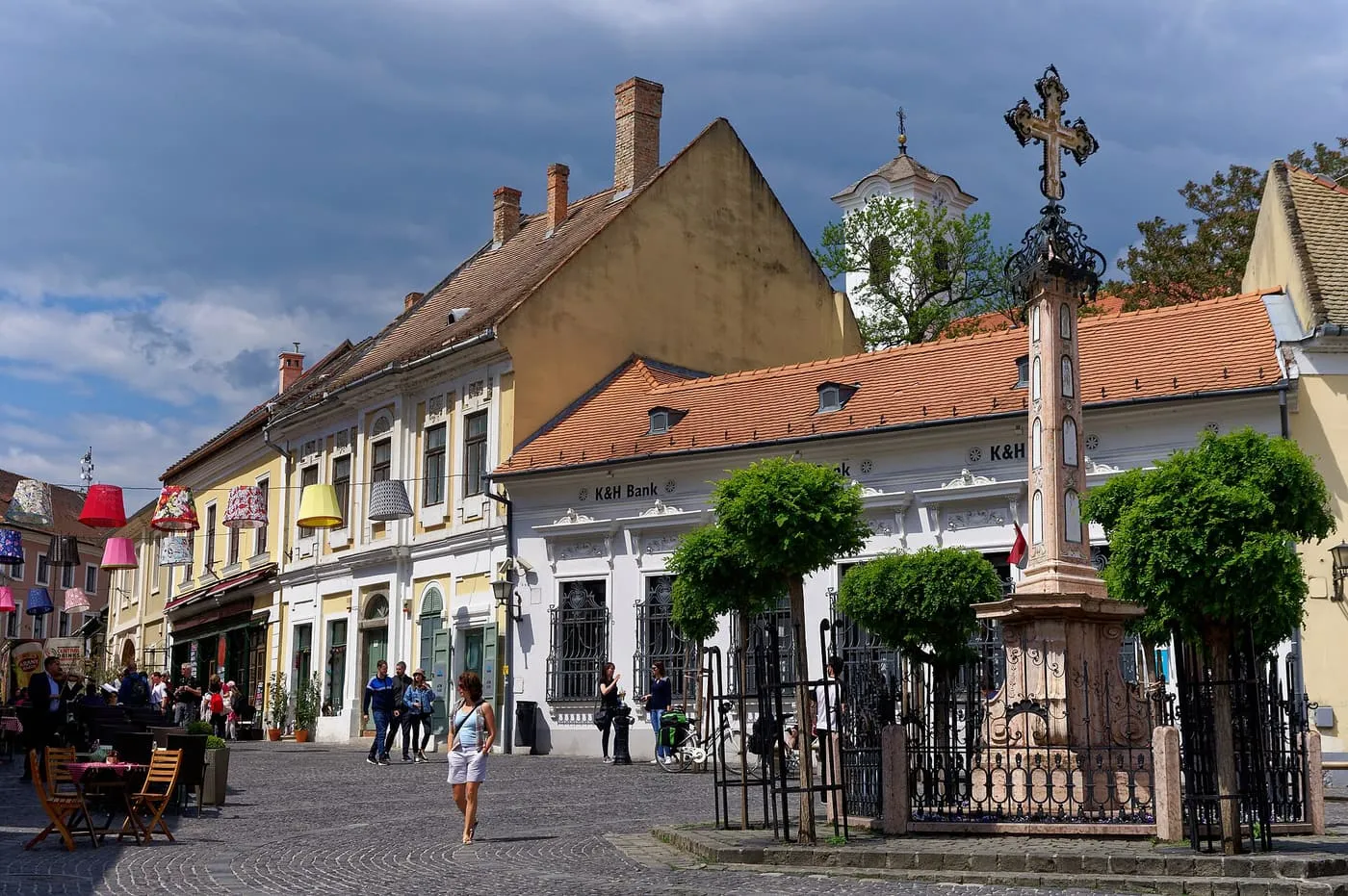Fő tér in Szentendre, with café tables, painted houses and the Serbian cross beside the square