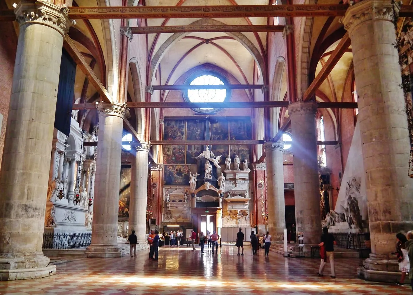 The nave of the Frari, with tall piers leading to the high altar