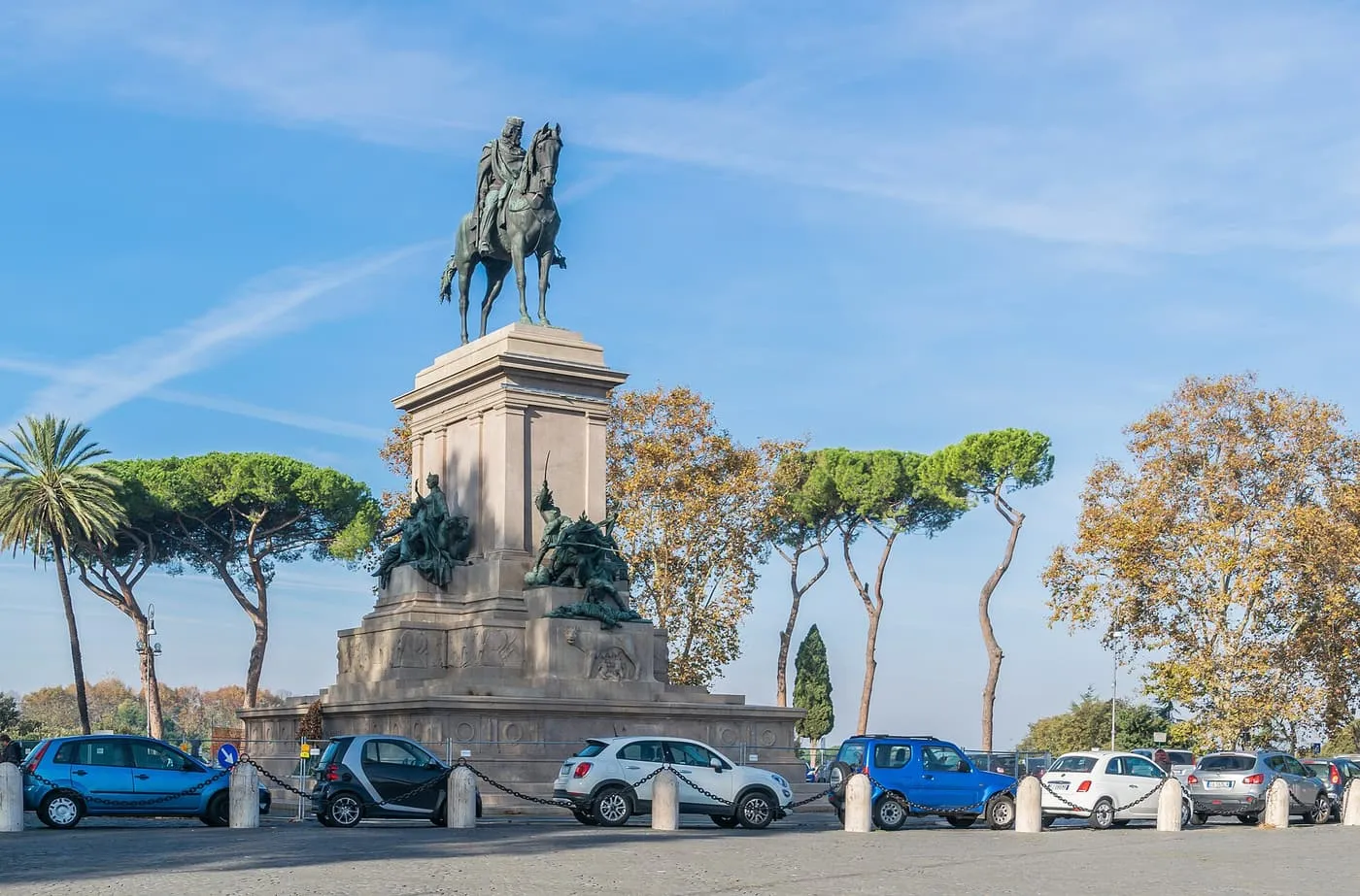 The equestrian monument to Giuseppe Garibaldi on the Gianicolo, on a tall stone base with bronze figures, among umbrella pines