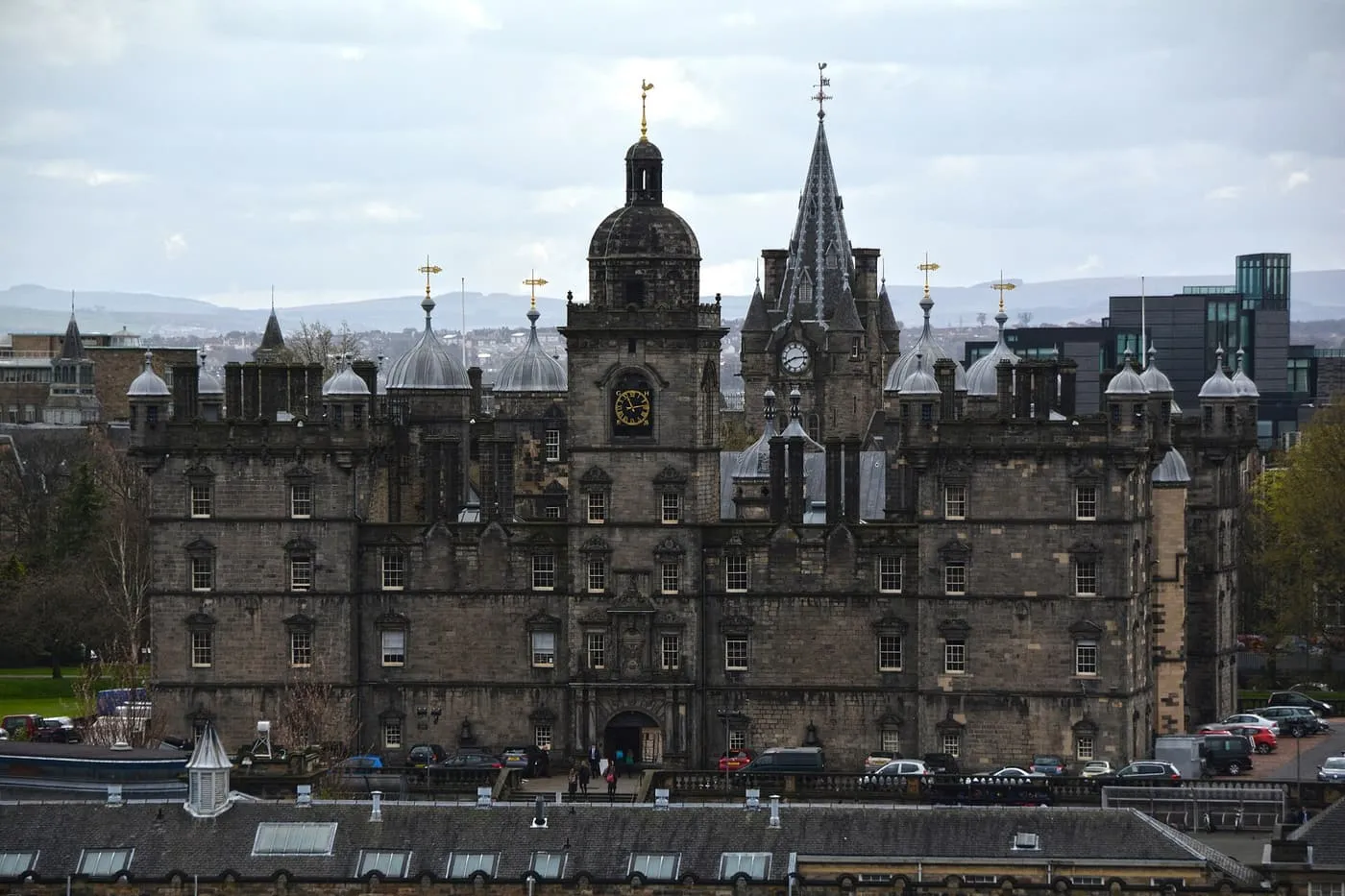 George Heriot's School seen across the rooftops, with its central clock tower, domed turrets and a stone spire