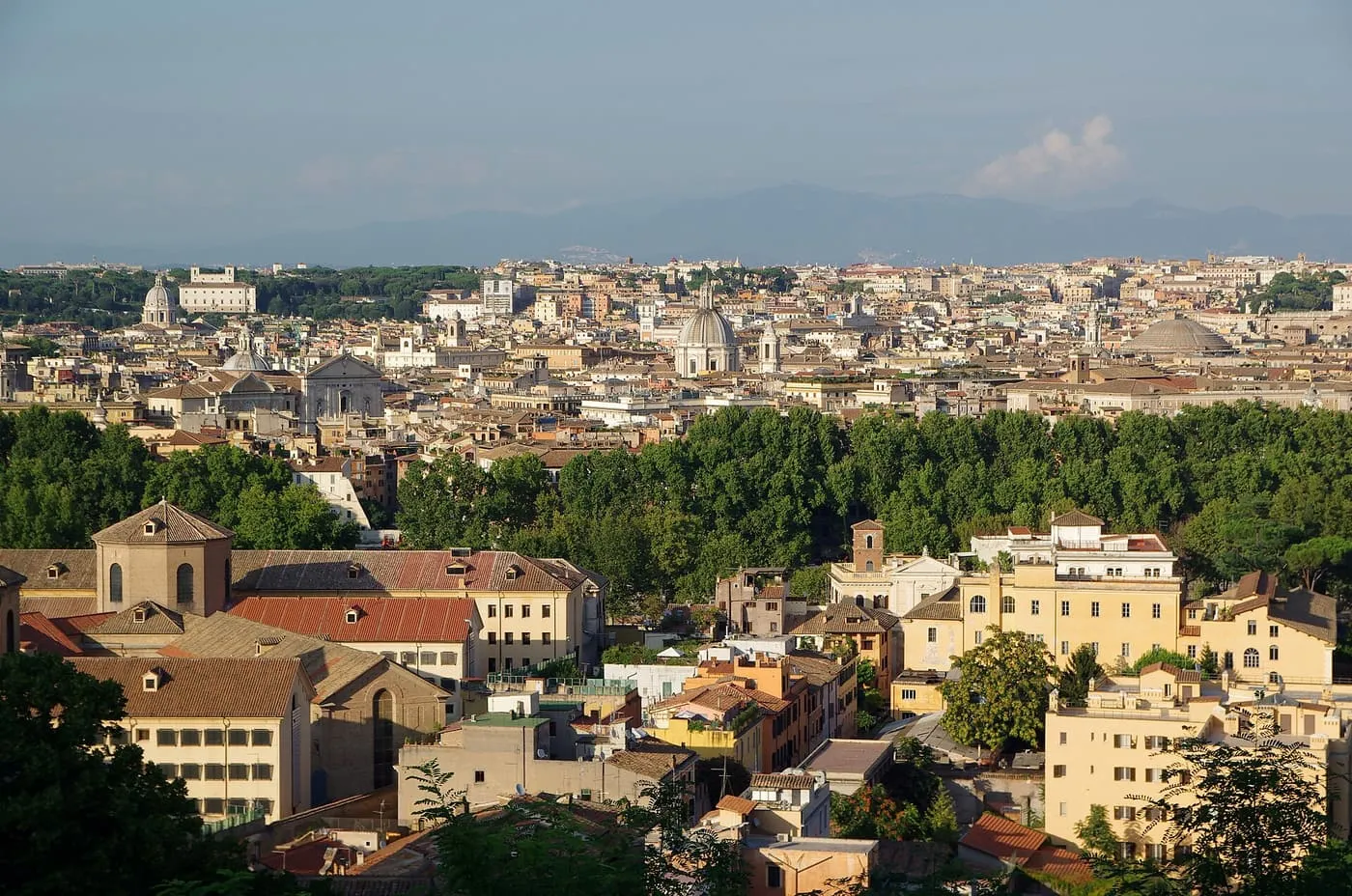 A view across the rooftops and domes of Rome from the Gianicolo, with the dome of the Pantheon at the right of the skyline