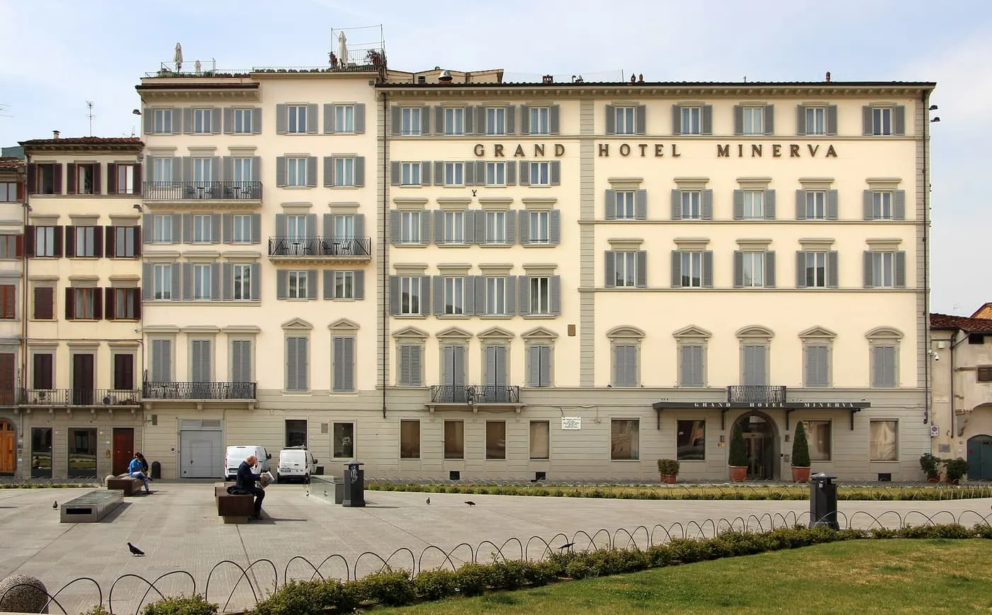 The pale front of the Grand Hotel Minerva across the lawn of Piazza di Santa Maria Novella
