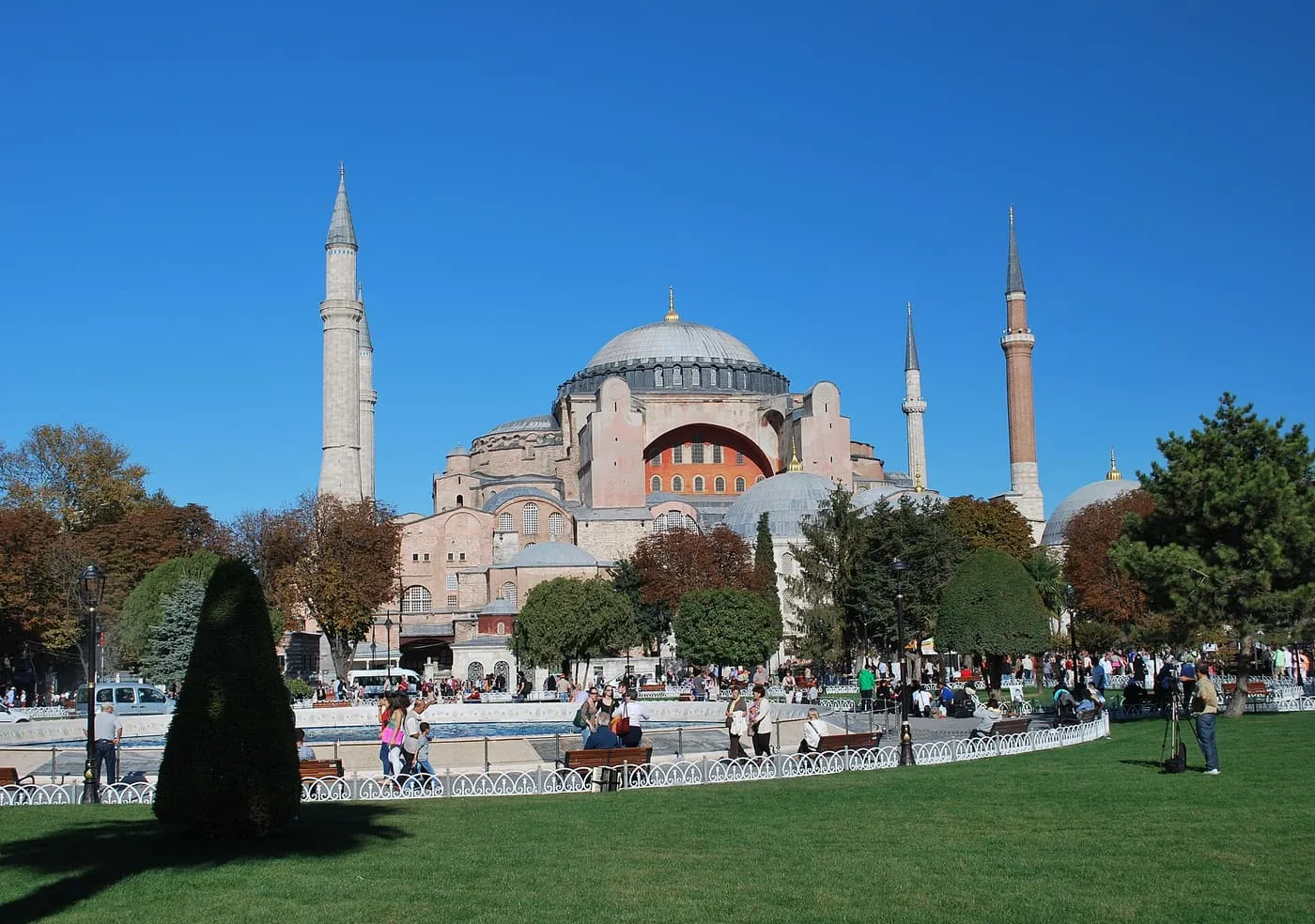 Hagia Sophia and its minarets across the lawns and fountain of Sultanahmet Park on a clear day