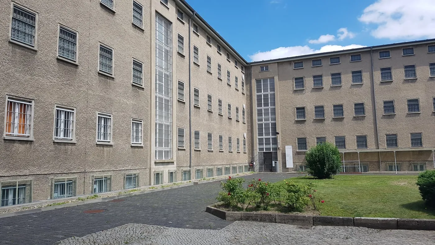 A courtyard at Hohenschönhausen, with the barred windows of the former prison wings on two sides
