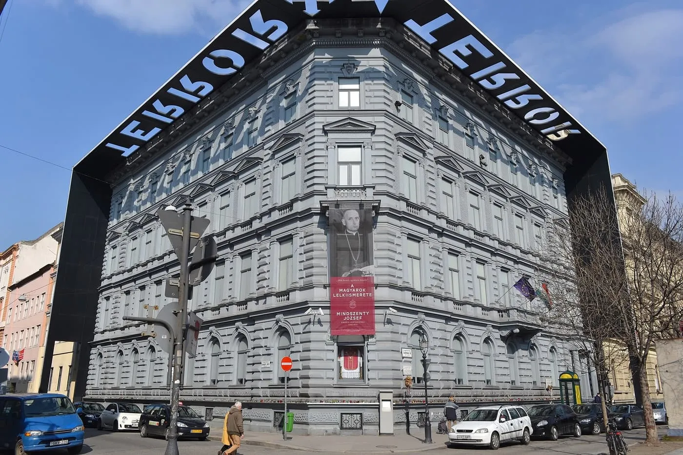 The grey corner building at Andrássy út 60 that houses the House of Terror, with the word TERROR cut into the black blade of its overhanging roof