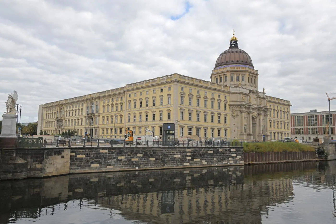 The Humboldt Forum, the rebuilt Berlin Palace with its domed portal, seen across the Spree with its reflection in the water