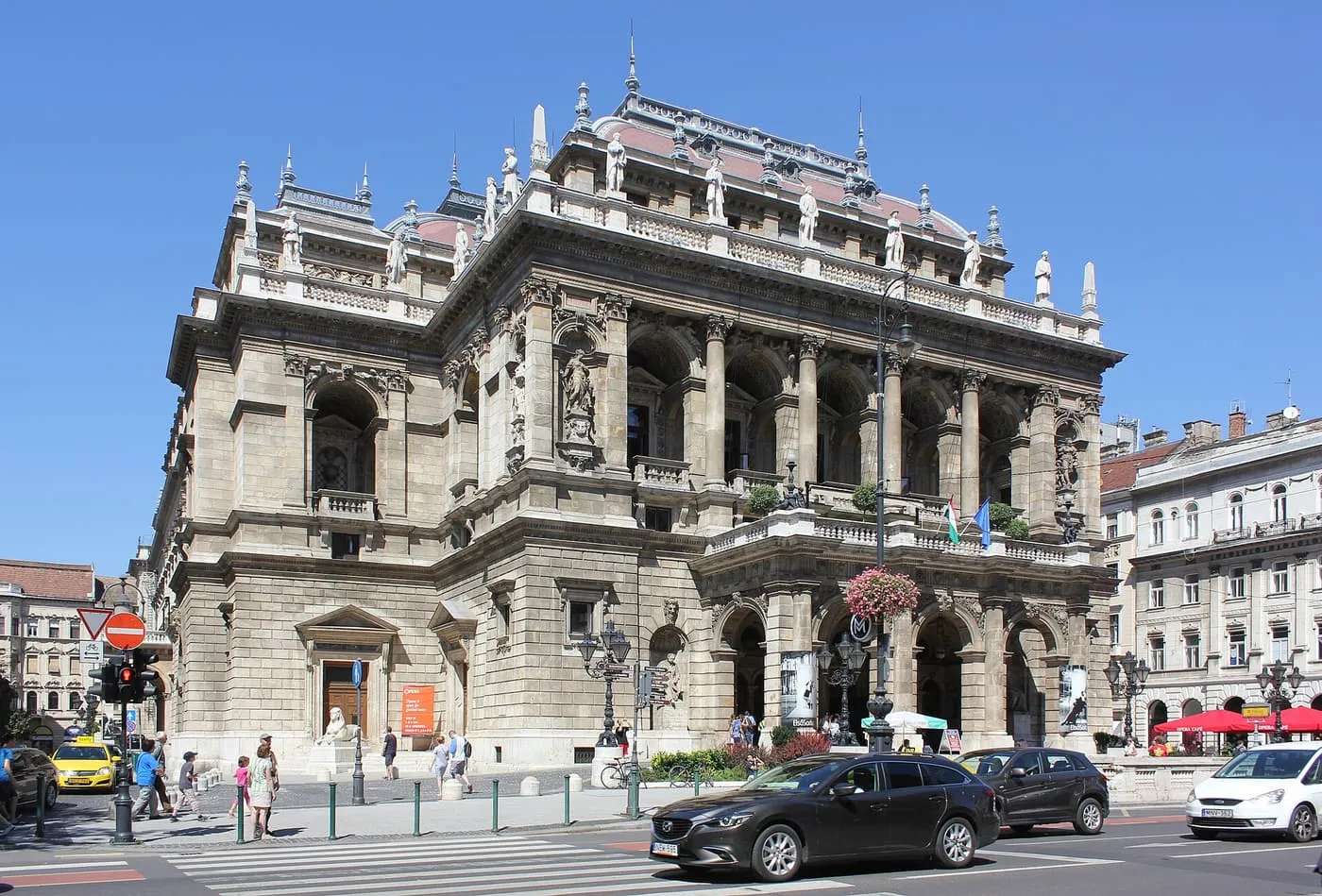 The Neo-Renaissance front of the Hungarian State Opera on Andrássy út, with a loggia of arches and statues on its upper floors