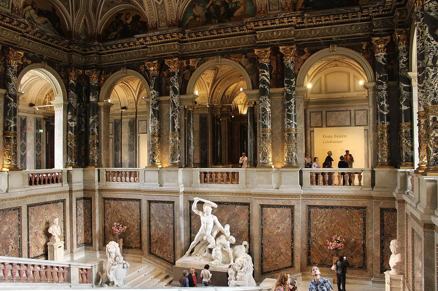 The marble staircase hall of the Kunsthistorisches Museum, with Canova's Theseus and the Centaur on the landing and arcades above