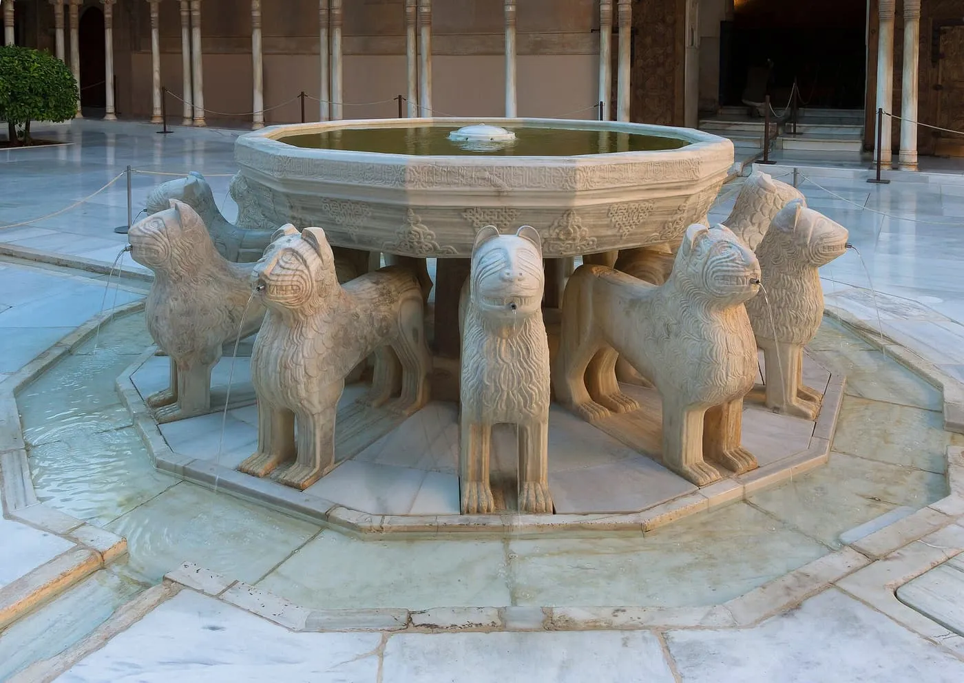 The Fountain of the Lions in the Alhambra: a marble basin carried on the backs of twelve carved lions, with water spouting from their mouths