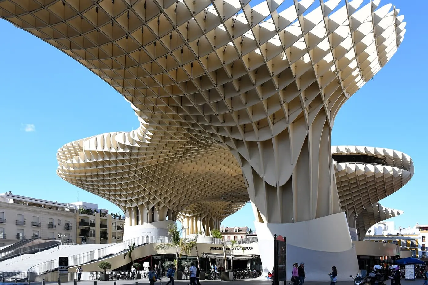 The wooden canopy of the Metropol Parasol rising above the Plaza de la Encarnación, with cafés and a ramp at its base