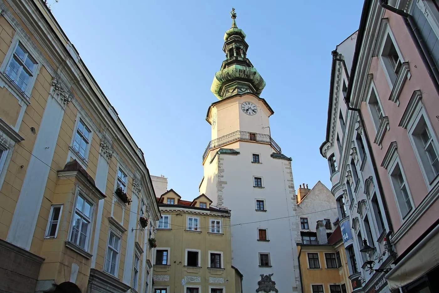 Michael's Gate tower with its green copper spire, rising above the painted houses of Bratislava's old town
