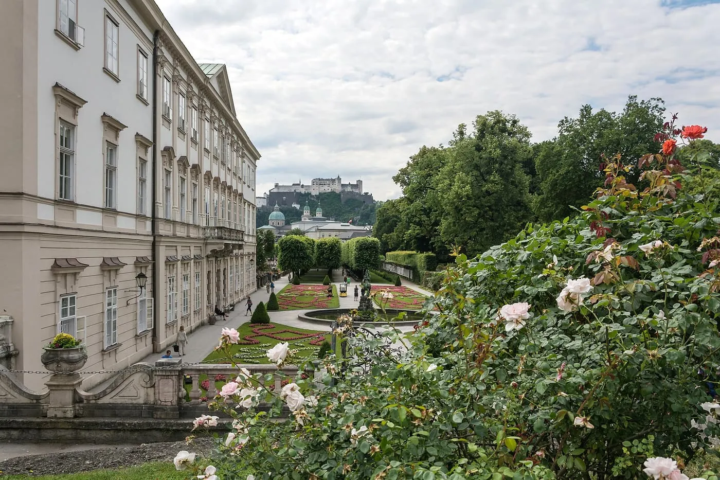 Mirabell Palace and the flower beds of the Mirabell Garden, with Hohensalzburg Fortress on the hill beyond