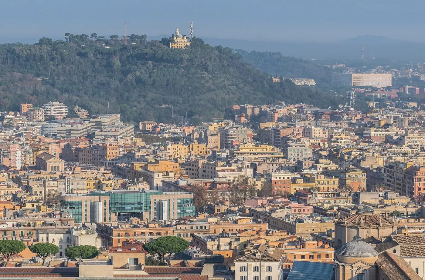 The wooded slope of Monte Mario with its observatory above the apartment blocks of northern Rome