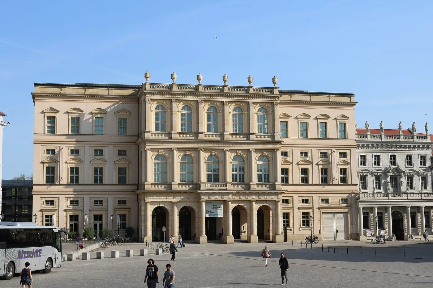 The cream-coloured front of the Museum Barberini on the Alter Markt in Potsdam, with a four-arched entrance