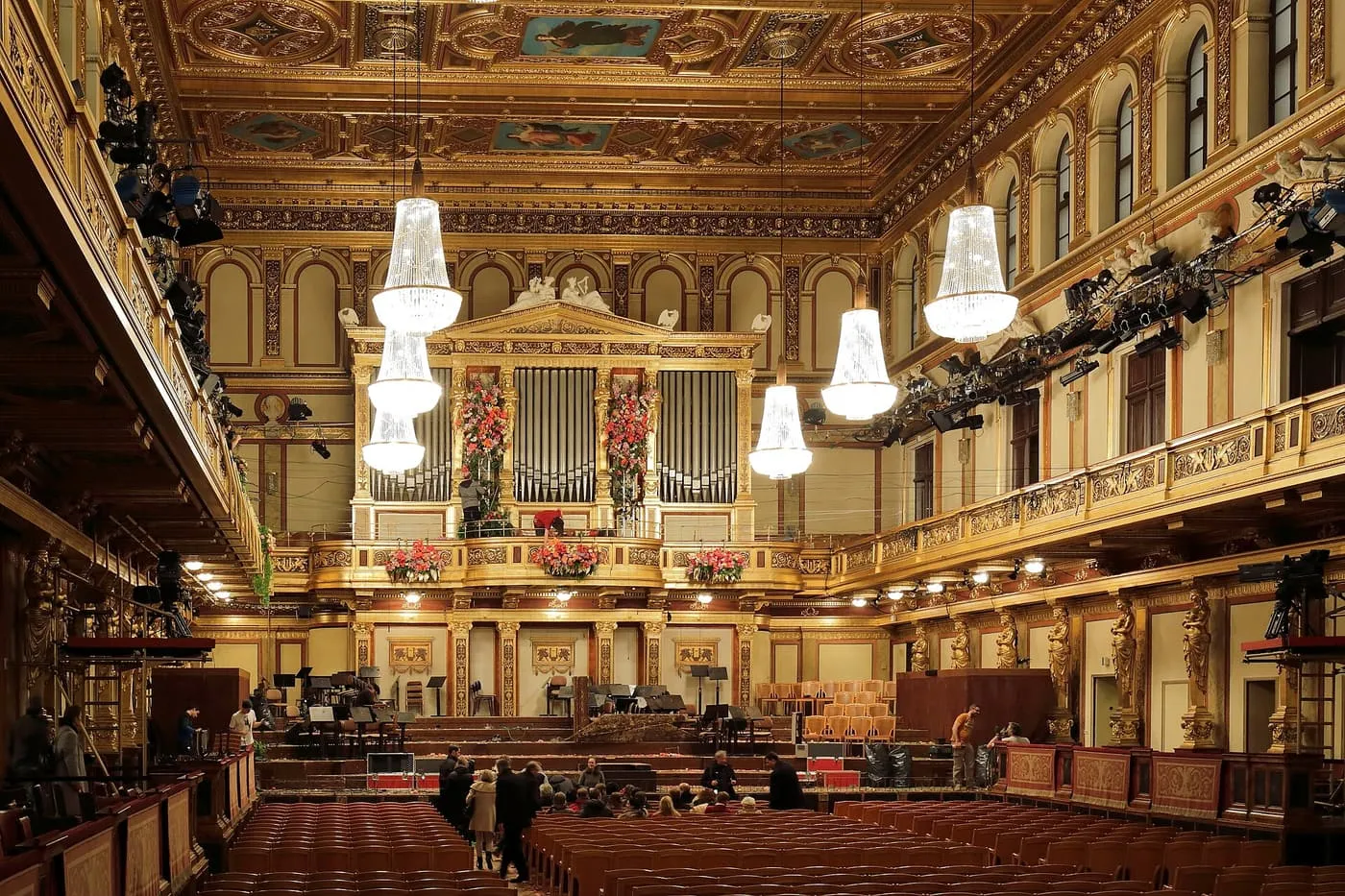 The Golden Hall of the Musikverein, with its gilded caryatids, organ and glass chandeliers above the stage and rows of red seats