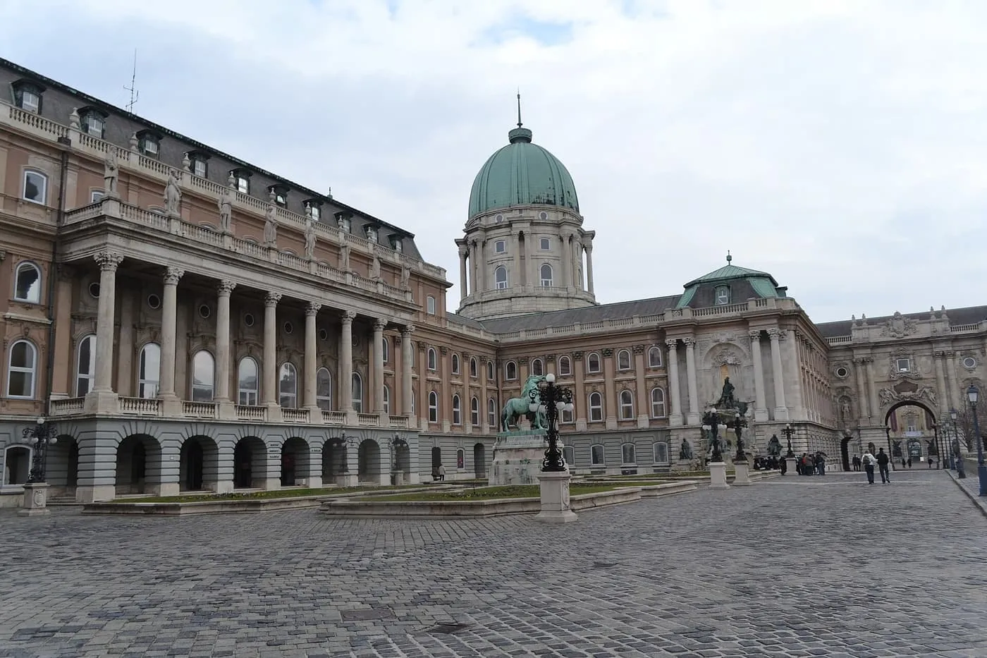 The green-domed Royal Palace on Castle Hill seen across its cobbled courtyard, home to the Hungarian National Gallery