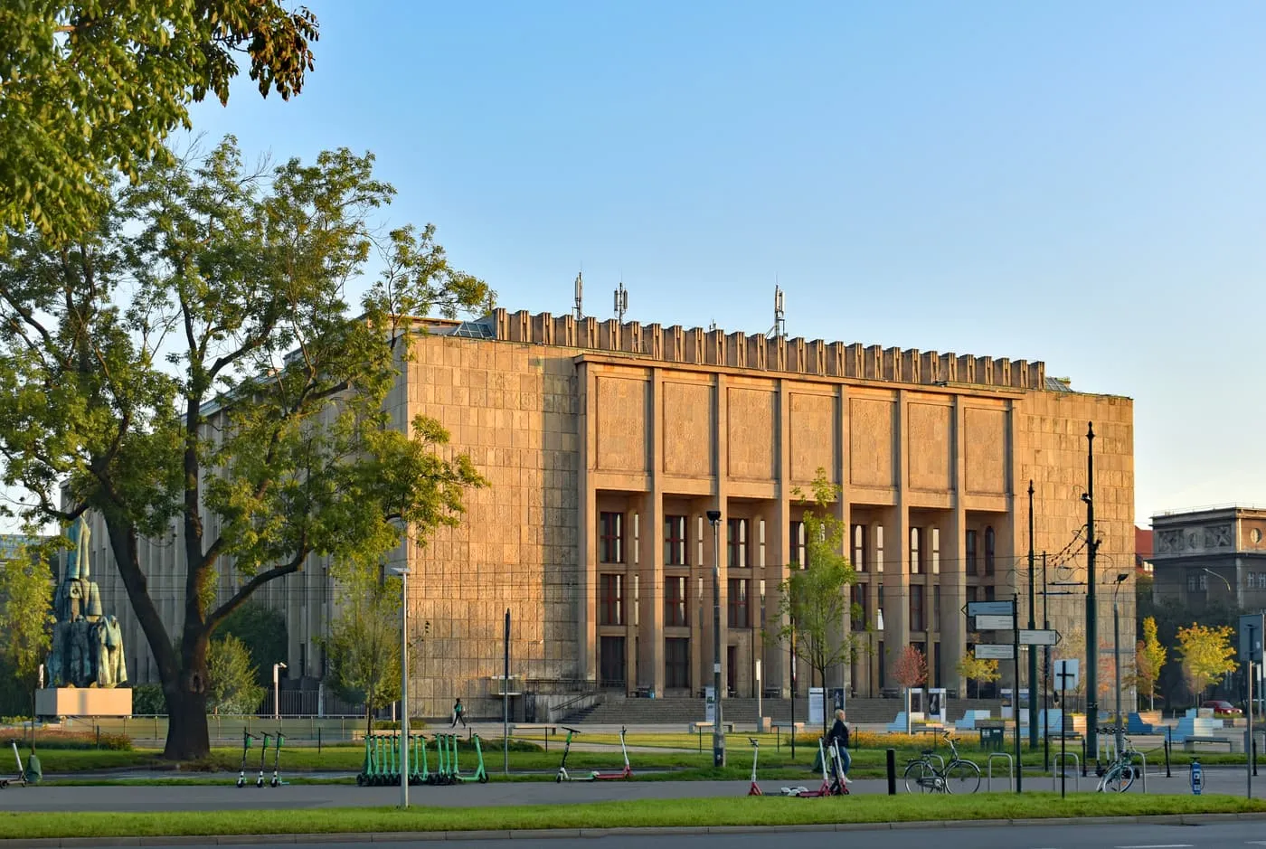 The National Museum Main Building, a pale stone block with a row of tall columns on its front, in low sun