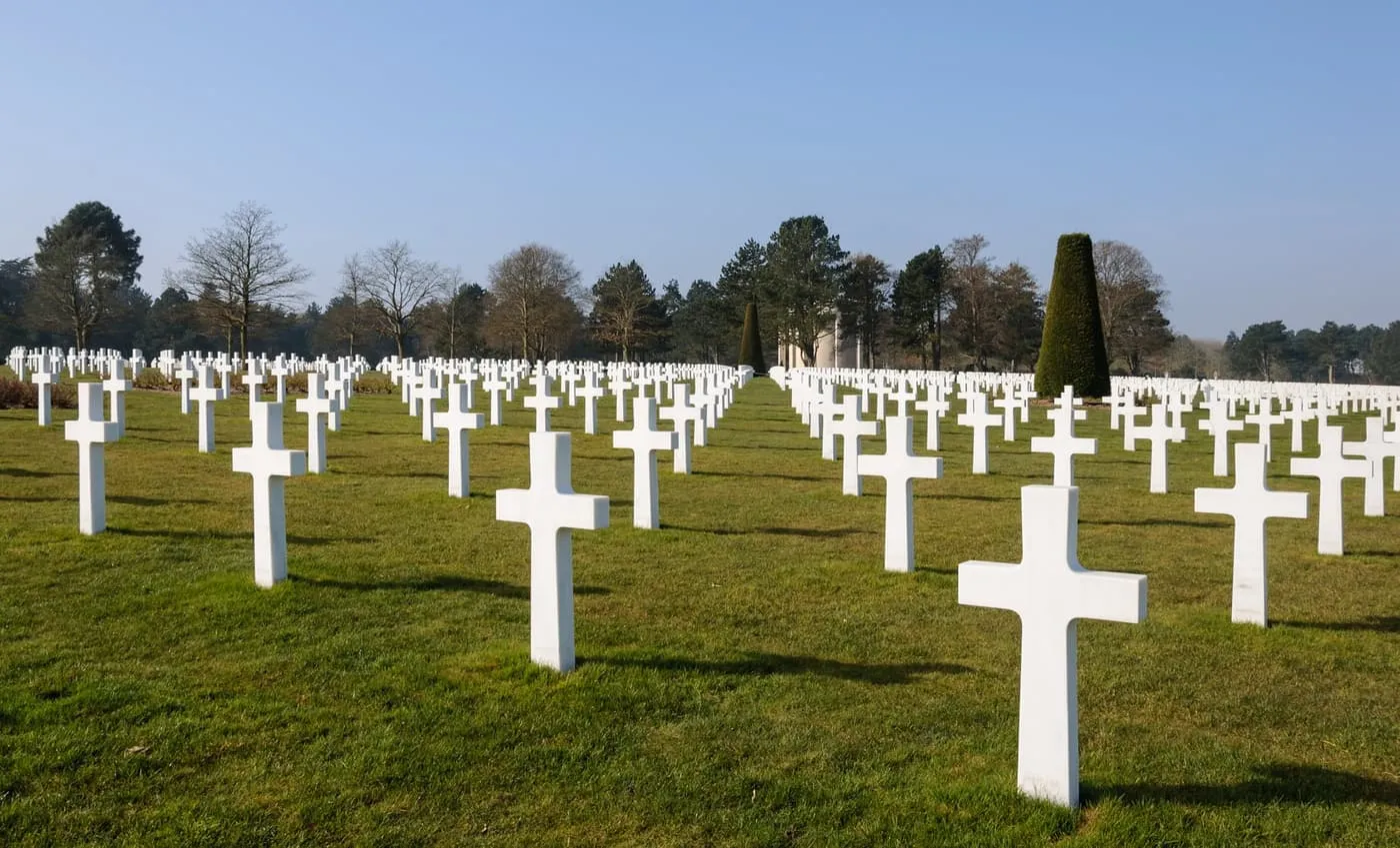 Rows of white marble crosses on the lawns of the Normandy American Cemetery