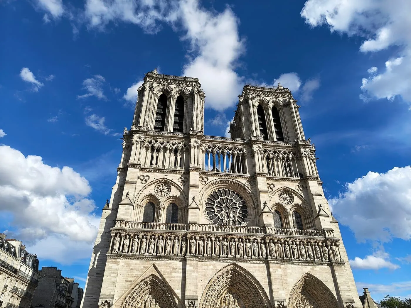 The two towers, rose window and Gallery of Kings of Notre-Dame against a deep blue sky