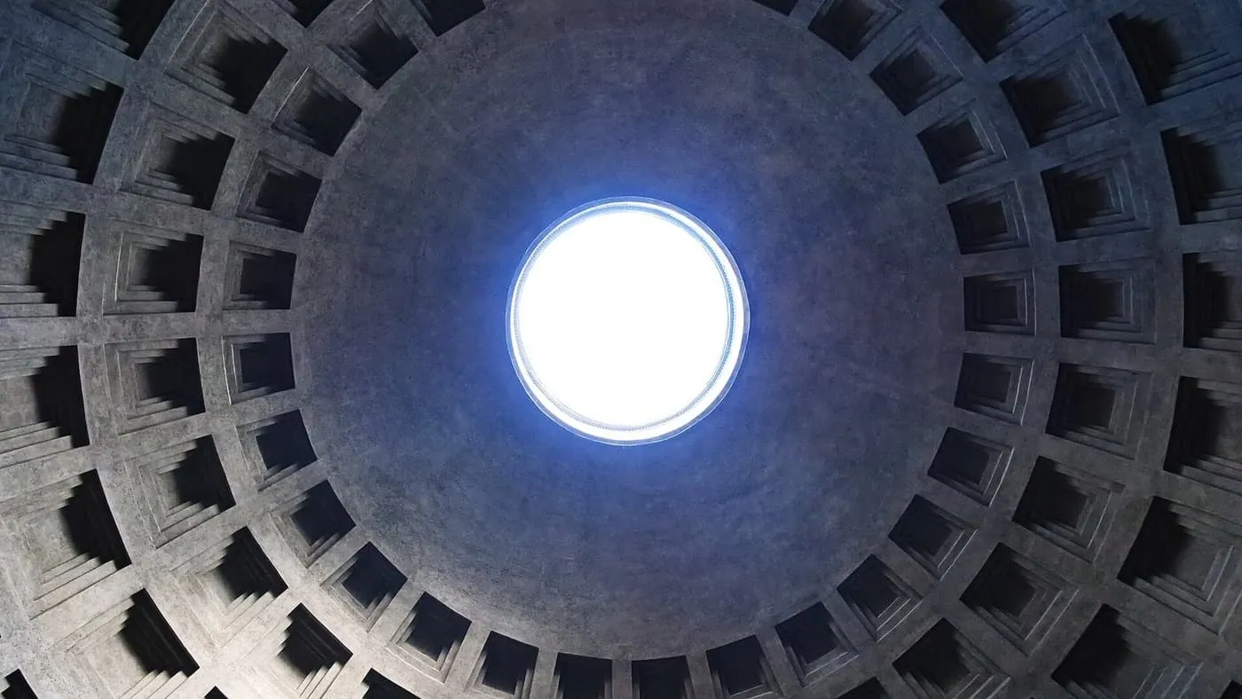 Looking up into the Pantheon's dome, with rows of square coffers around the round opening at the top
