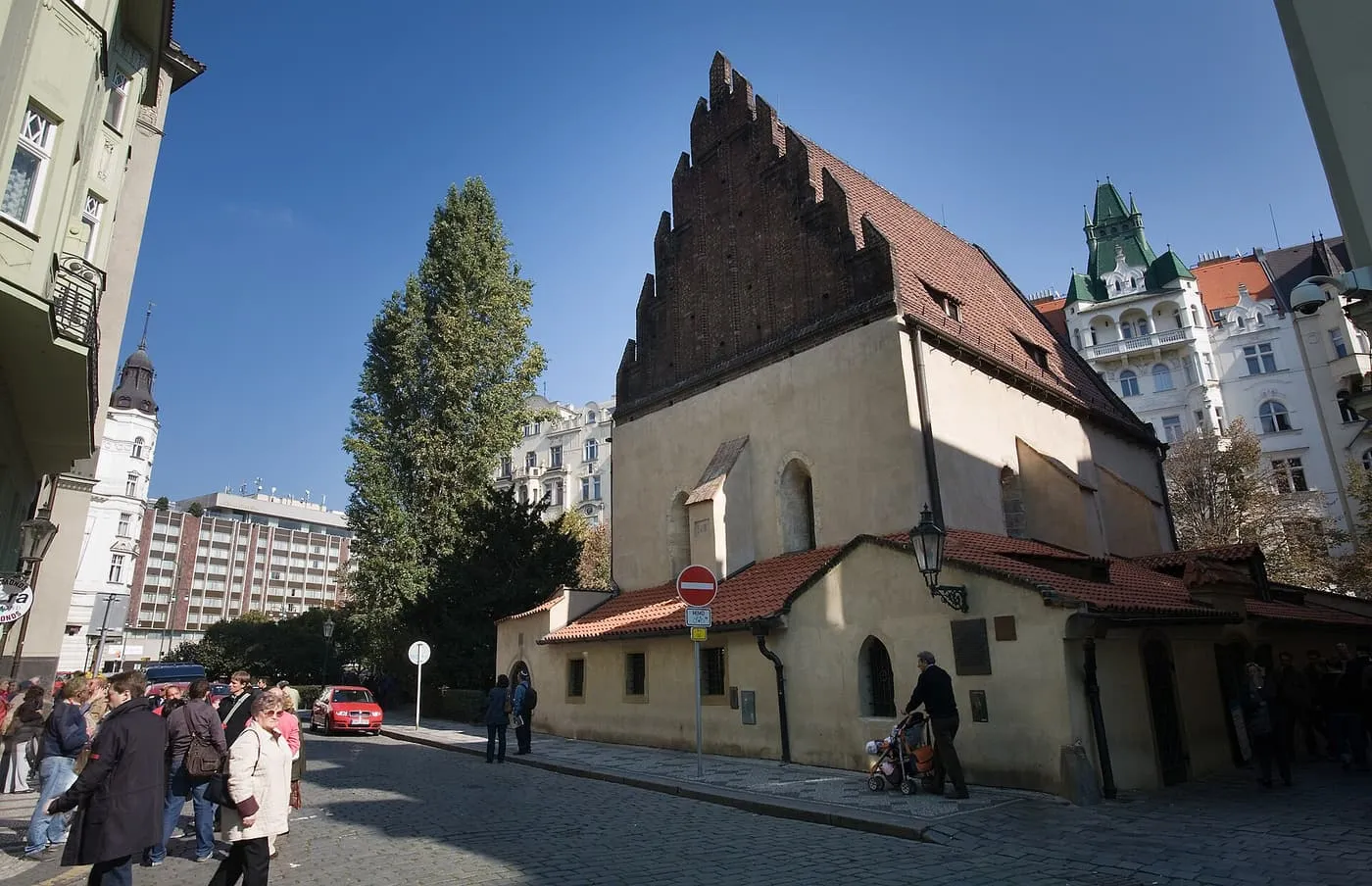 The Old-New Synagogue, with its stepped brick gable, on a corner in Josefov