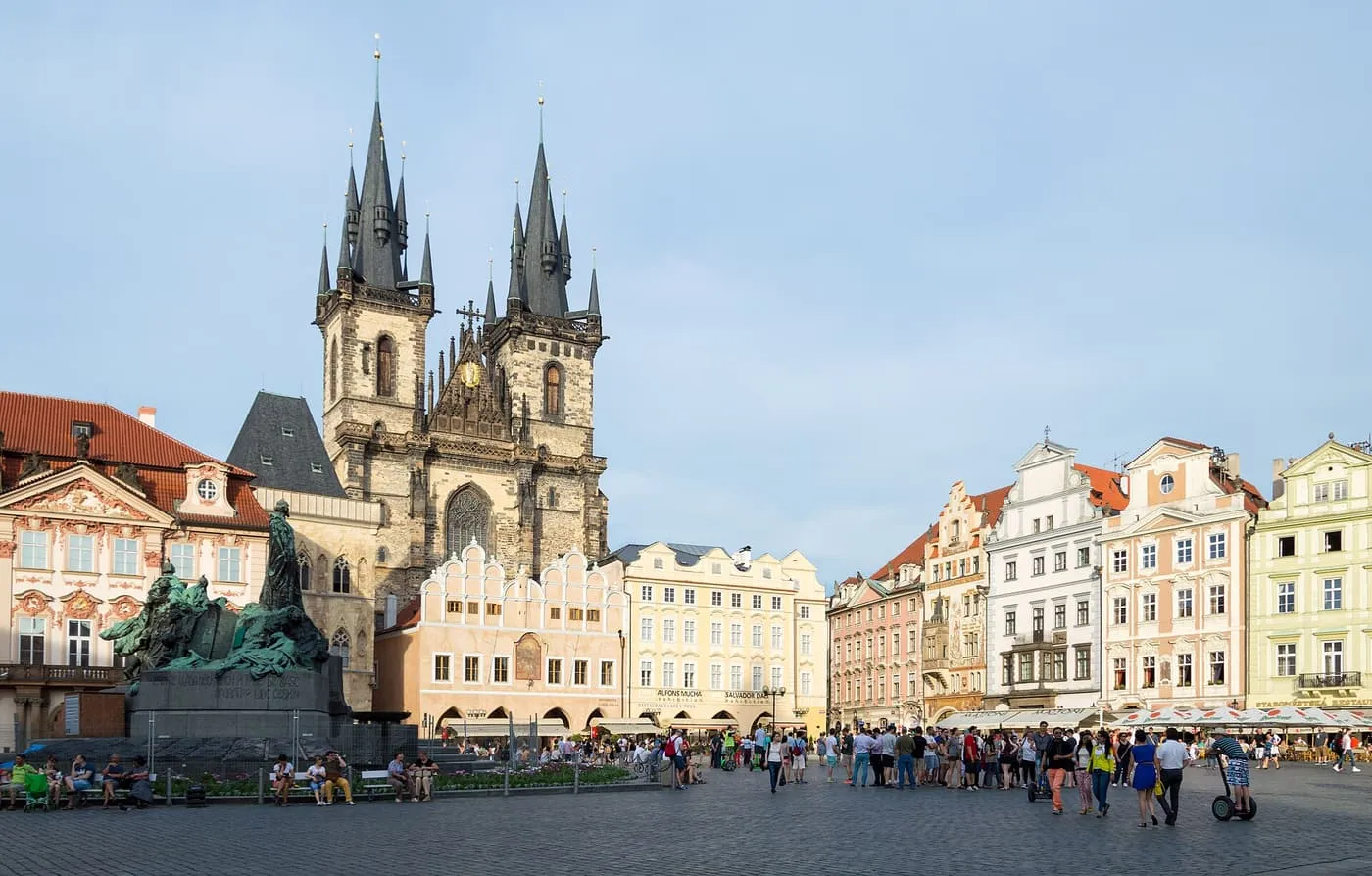 Old Town Square in Prague, with the twin spires of the Church of Our Lady before Týn and the Jan Hus Memorial