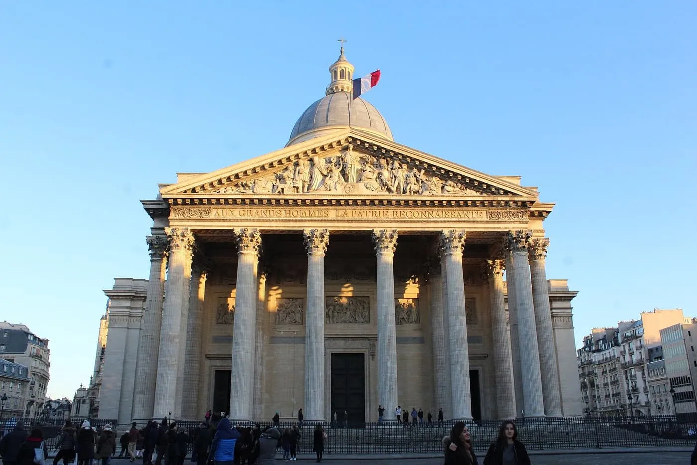 The columned portico and dome of the Panthéon, with visitors on the square below