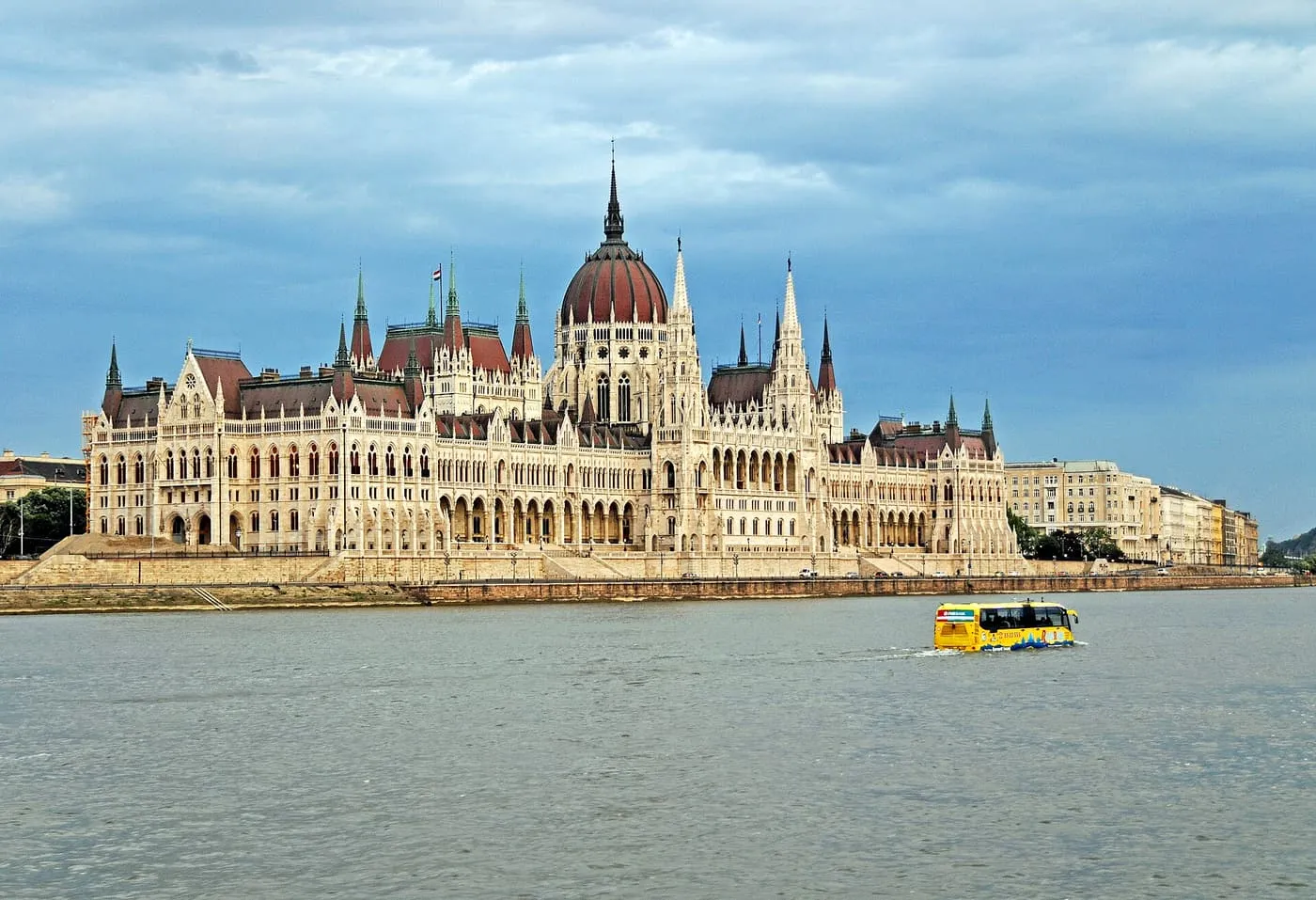 The Hungarian Parliament on the Pest bank, with its red dome and spires, seen across the Danube