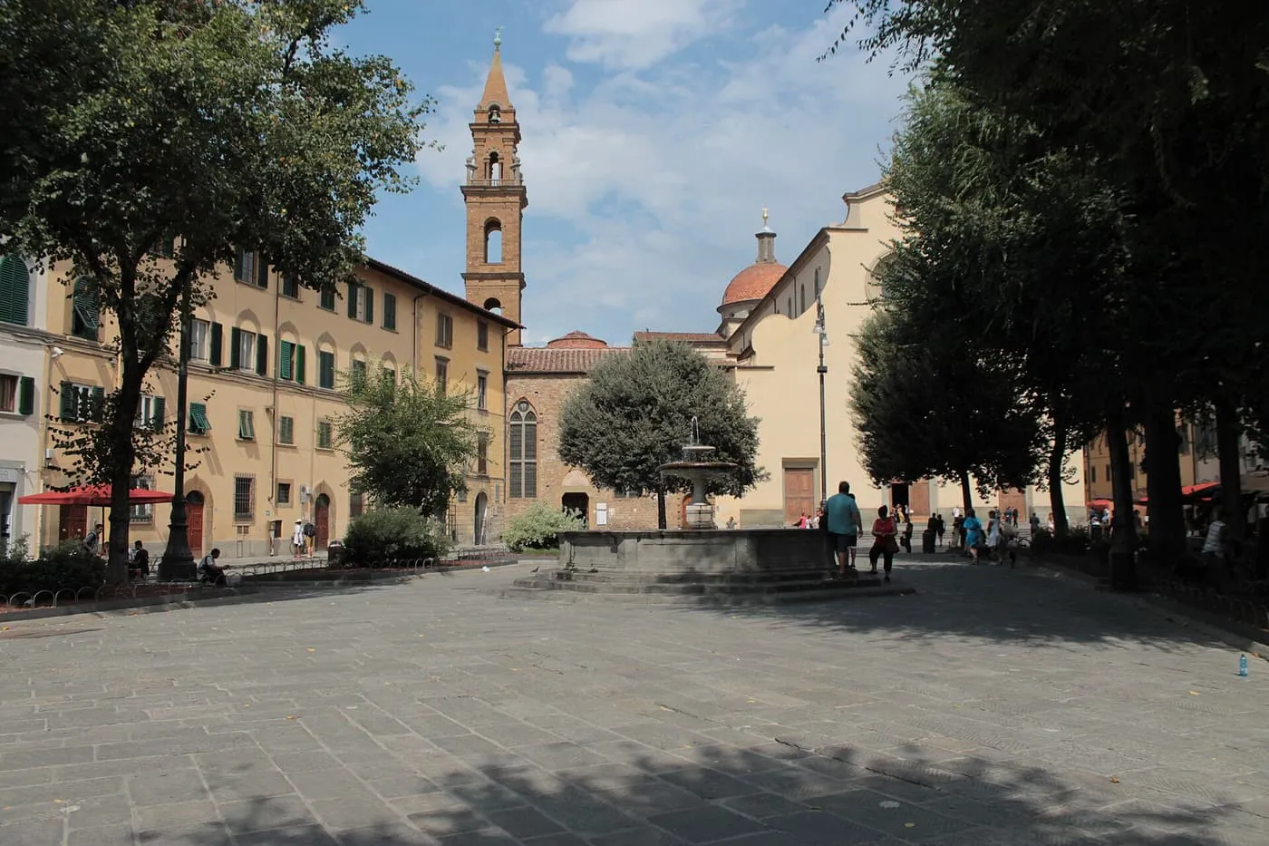 Piazza Santo Spirito with its fountain and plane trees, and the basilica with its bell tower and dome behind