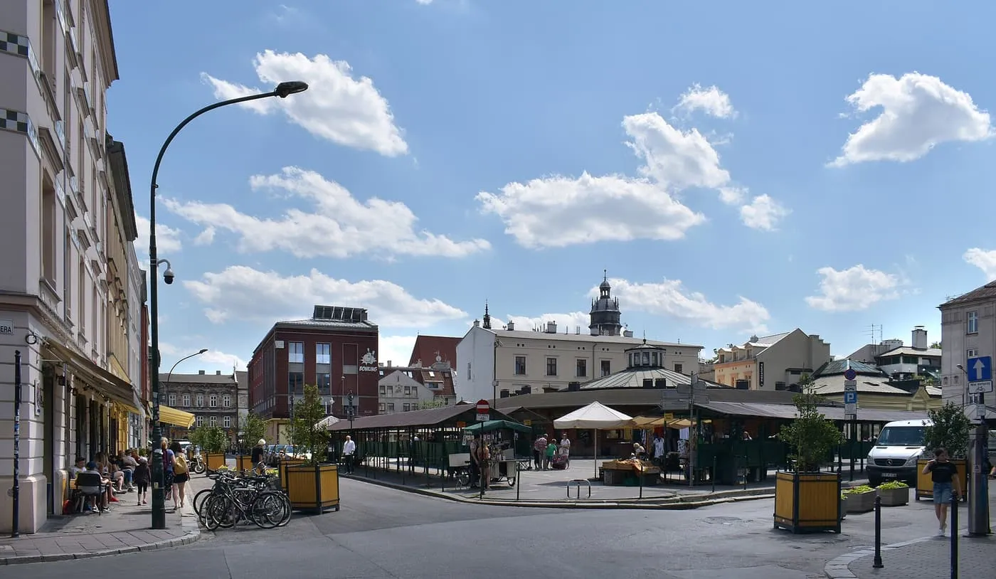 Plac Nowy in Kazimierz, an open square with cafés, market stalls and a domed building at its far side