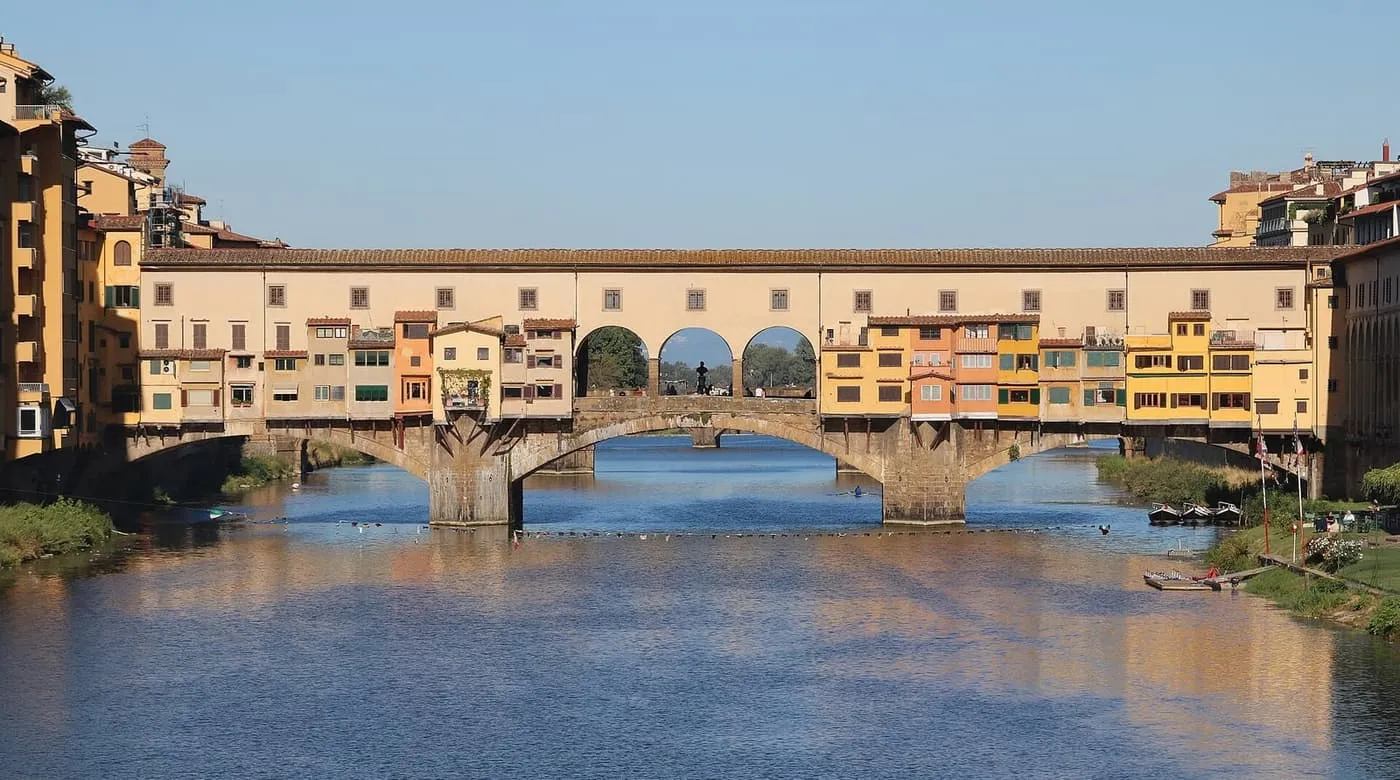 The Ponte Vecchio across the Arno, with shops and houses built along the bridge