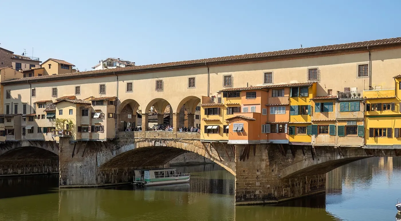 The Ponte Vecchio over the Arno, with its shop fronts along the edge of the bridge
